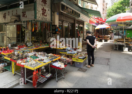 Hong Kong, China - May 24 2018: Antiques, memorabilia and other knick knacks stall in the historic Cat Street market in Soho, Hollywood road in Hong K Stock Photo