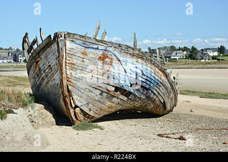 Old shipwreck on beach in France Stock Photo