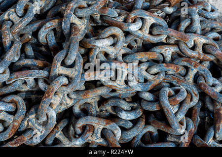 Old rusted  chains with cracked blue paint Stock Photo