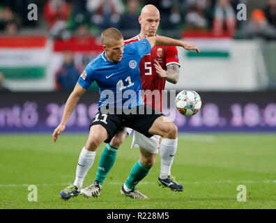 Budapest, Hungary. 15th November, 2018. Henrik Ojamaa of Estonia #11 competes for the ball with Botond Barath of Hungary #5 during the UEFA Nations League group stage match between Hungary and Estonia at Groupama Arena on November 15, 2018 in Budapest, Hungary. Credit: Laszlo Szirtesi/Alamy Live News