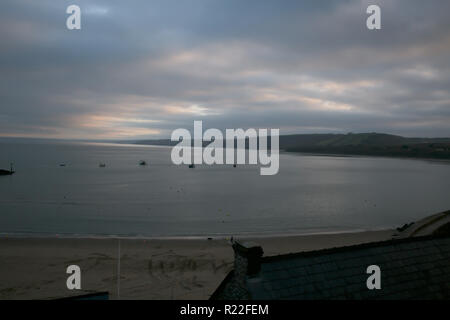 New Quay, Wales, UK,16th November 2018, Sun shines through the clouds in New Quay, Wales. Fisherman load their boats up with crates and head off out to sea. Credit: Keith Larby/Ģ����ý Live News Stock Photo