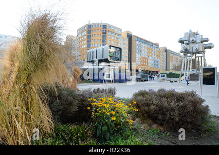 A technological-information centre including a restaurant with robotically operated service called Cyberdog (left) is seen near the Nove Butovice metro station in Prague, Czech Republic, on November 16, 2018. The Cyberdog was created by Czech sculptor David Cerny. On the right side is seen the Trifot kinetic sculpture earlier created also by David Cerny. (CTK Photo/Michaela Rihova) Stock Photo