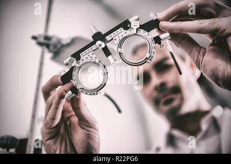 Close-up of optometrist holding messbrille Stock Photo