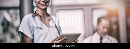Doctor and nurse using digital tablet Stock Photo