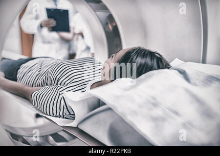 Female patient undergoing CT scan Stock Photo