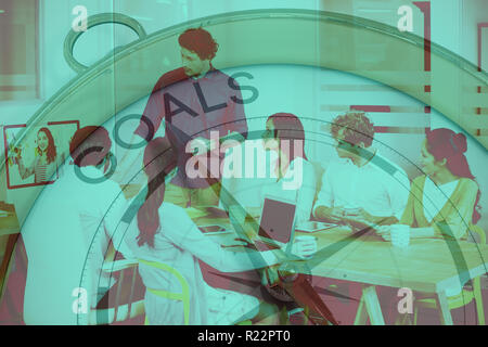Composite image of compass pointing to goals Stock Photo