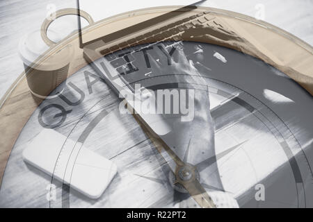 Composite image of compass pointing to quality Stock Photo