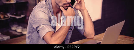 Side view of hipster man working Stock Photo
