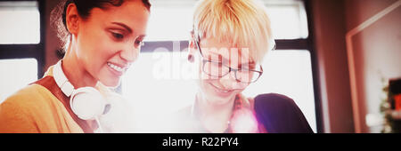 Two female graphics designer using digital tablet Stock Photo