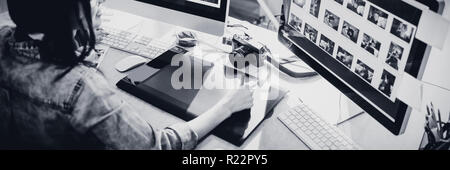 High angle view of graphic designer using graphics tablet Stock Photo