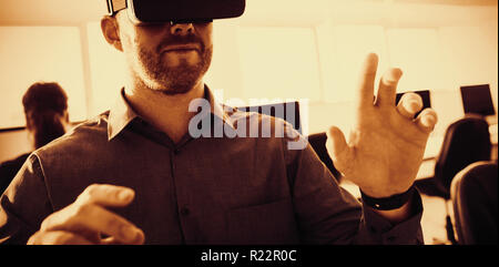 Businessman using virtual reality simulator Stock Photo