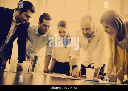 Serious photo editors looking at photos Stock Photo