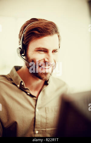 Customer service executive working in call center Stock Photo