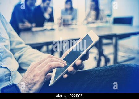 Midsection of businessman using digital tablet Stock Photo