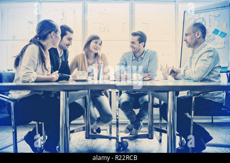 Business people interacting with each other Stock Photo