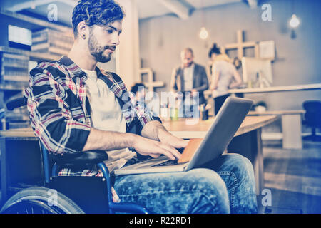 Graphic designer using laptop Stock Photo