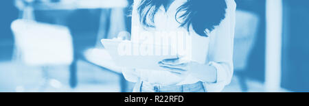 Smiling businesswoman using digital tablet Stock Photo