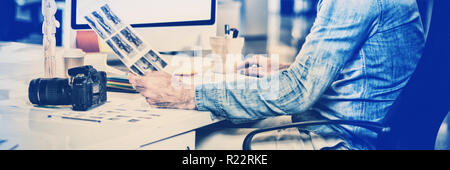 Photo editor working on computer Stock Photo