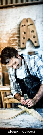 Carpenter working on his craft Stock Photo