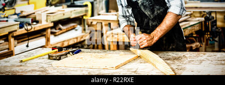 Carpenter working on his craft Stock Photo