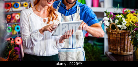 Couple using digital tablet Stock Photo