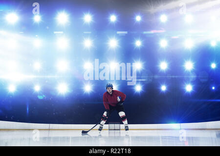 Composite image of player playing ice hockey Stock Photo