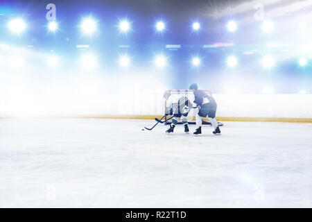 Composite image of players playing ice hockey Stock Photo