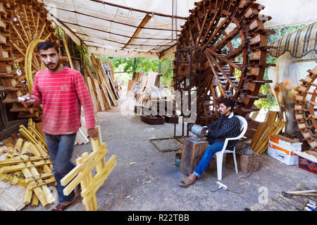 Hama, Hama Governorate, Syria : Artisans at work building decorative norias. Stock Photo