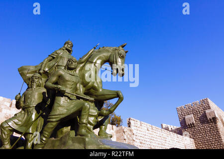 Damascus, Syria : Equestrian bronze statue of Kurdish Ayyubid Sultan Saladin in front of the 11th century Citadel designed by Syrian sculptor Abdallah Stock Photo