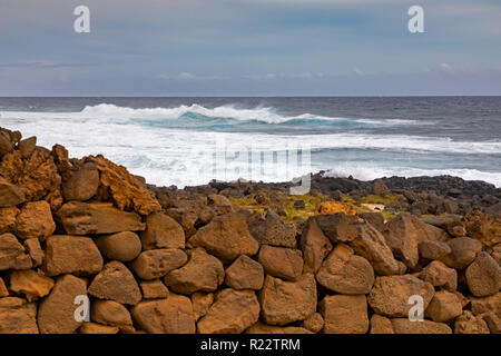 Ka Lae, Hawaii - A rock wall at the southernmost point in the United States, also called South Point, on Hawaii's Big Island. Stock Photo