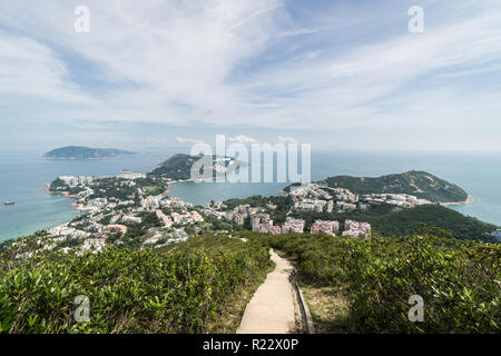 View over the Stanley town from the Wilson hiking trail in the hills in the south of Hong Kong island in China. Stock Photo