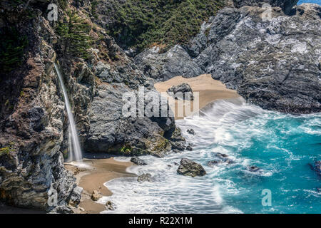 'McWay Falls Surf' Idyllic McWay Falls, along the Big Sur area of Central California, is said to be one of only two waterfalls in California that empt Stock Photo