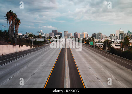 Horizontal landscape view of San Diego, California, USA Skyline with empty freeway in foreground. The 5 freeway travels most of the coast of the weste Stock Photo