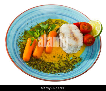 pollock with vegetables. Isolated over white background Stock Photo