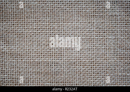 Close-up of a burlap jute canvas full frame background with vignetting. Stock Photo