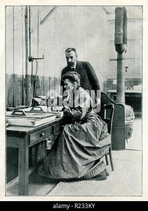 Curie, Marie <1867-1934>, physicist and chemist and Pierre Curie <1859-1906> in their laboratory, Stock Photo