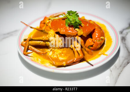 Singapore style hot chilli crab served on China Town. South east Asia seafood dish. Stock Photo