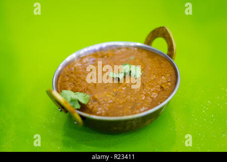 Spicy mutton curry in Singapore served on Little India. South east Asia indian dish. Stock Photo