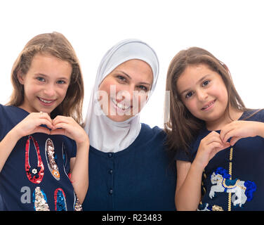 Happy Muslim Family, Mother and Her Daughters With Hand Gesture of Love Sign of Mom Isolated on White Background Stock Photo