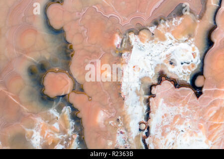 Brown, red, white, yellow onyx background. Onyx stone texture on macro. Stock Photo