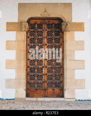 Wooden old door in Sitges, Spain Stock Photo