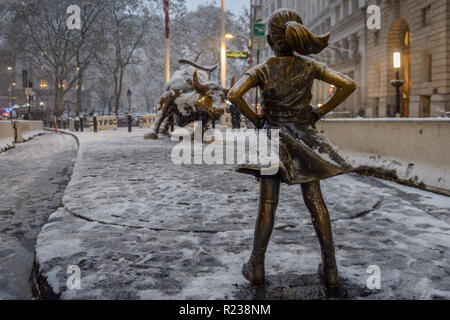 New York, United States. 15th Nov, 2018. Fearless Girl statue covered in snow as New York City was hit by the first snow of the season on November 15, 2018 around noon, bringing a hodge-podge wintry conditions. The city's emergency management service advised New Yorkers to be aware of slippery conditions, also issued a travel advisory for Thursday particularly during the evening commute. Credit: Erik McGregor/Pacific Press/Alamy Live News Stock Photo