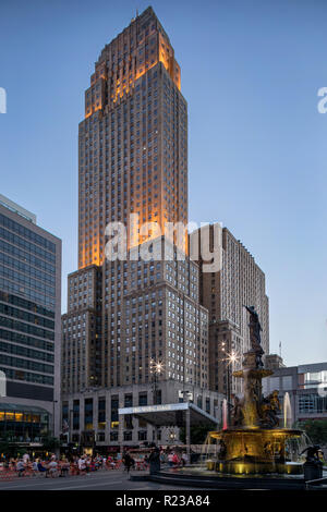 The historic Hilton Netherland Plaza Hotel stands above Fountain Square during sunset over downtown Cincinnati on a clear October evening recently. Stock Photo