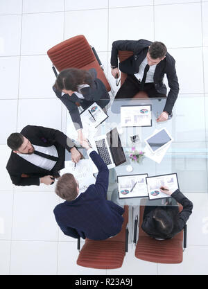 top view.handshake business partners after discussing the financial terms of the contract Stock Photo