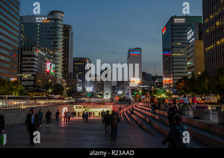 Gwanghwamun Square in Seoulat night, Tall office buildings reach for the sky adorned with neon signs. Stock Photo