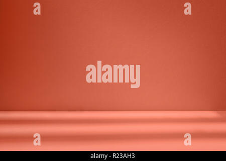 Orange studio space with artistic window shadow. Template and background Stock Photo