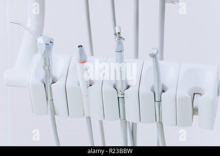 Closeup of dental drills in dentists office. Medical equipment and stomatology concept. Dental office. White tone. Stock Photo