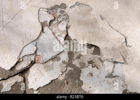 Ramshackle old plastered wall, fragment Stock Photo