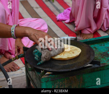 Cooking Tandoori naan or Roti at local restaurant in Jodhpur, India. Stock Photo