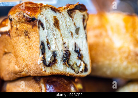 Brioche style sweet loaf with cinnamon, walnuts, raisins. Homemade poppy seed braided bread, close up selective focus. National pastries. Stock Photo